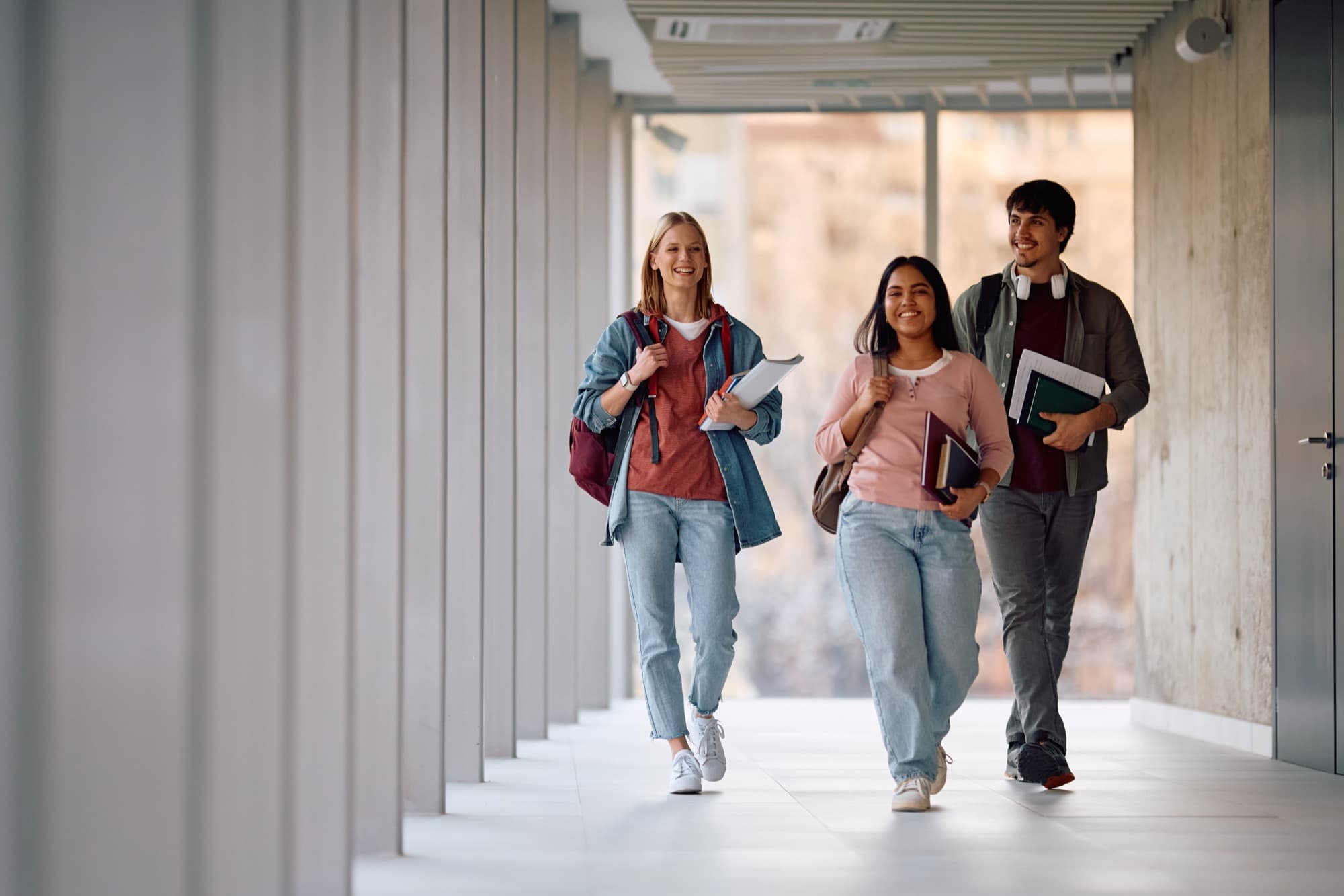 Students walking through a university corridor